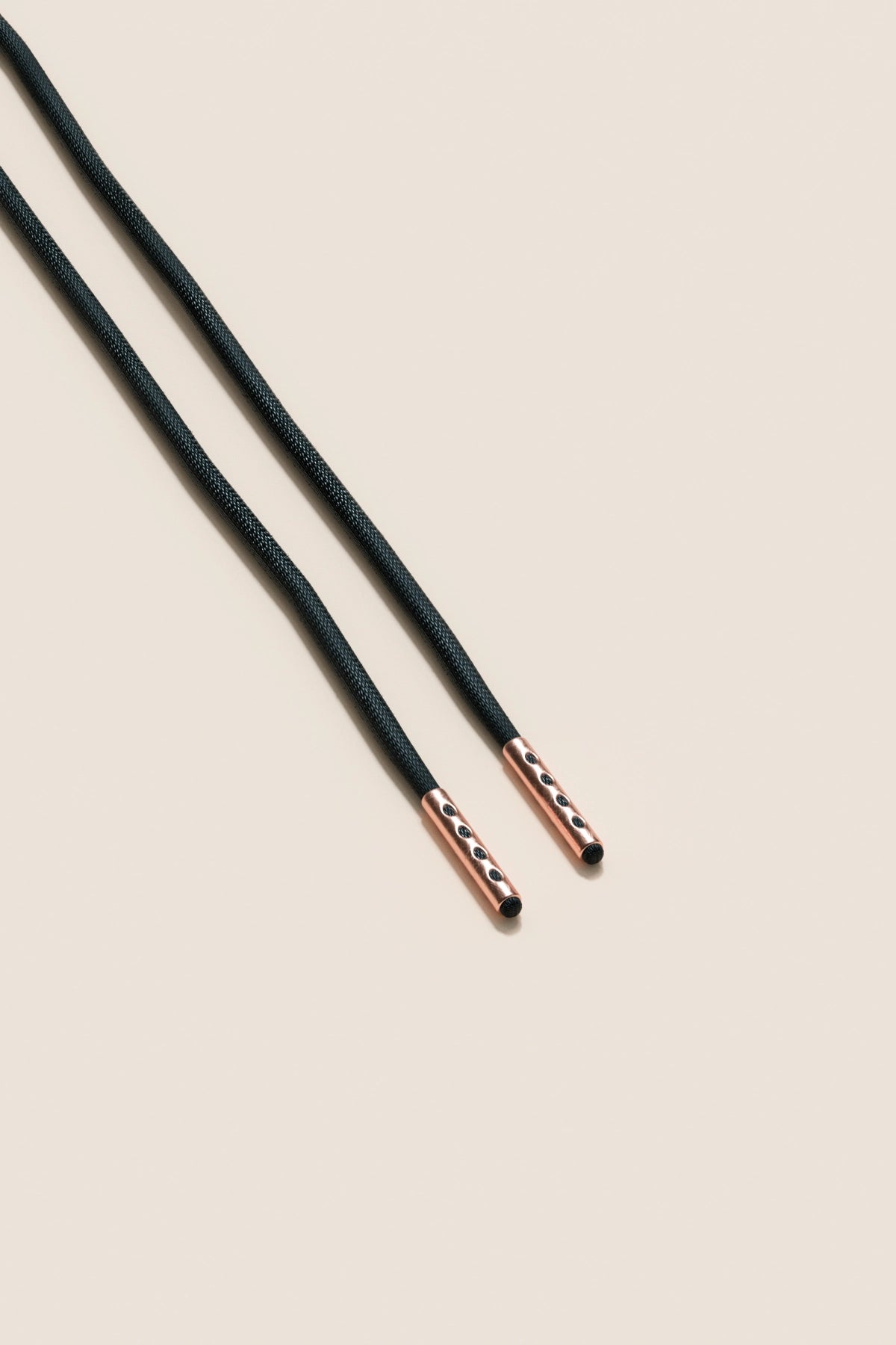 Senkels Black 2.5mm Round Waxed Shoelaces with Rose Gold Aglets