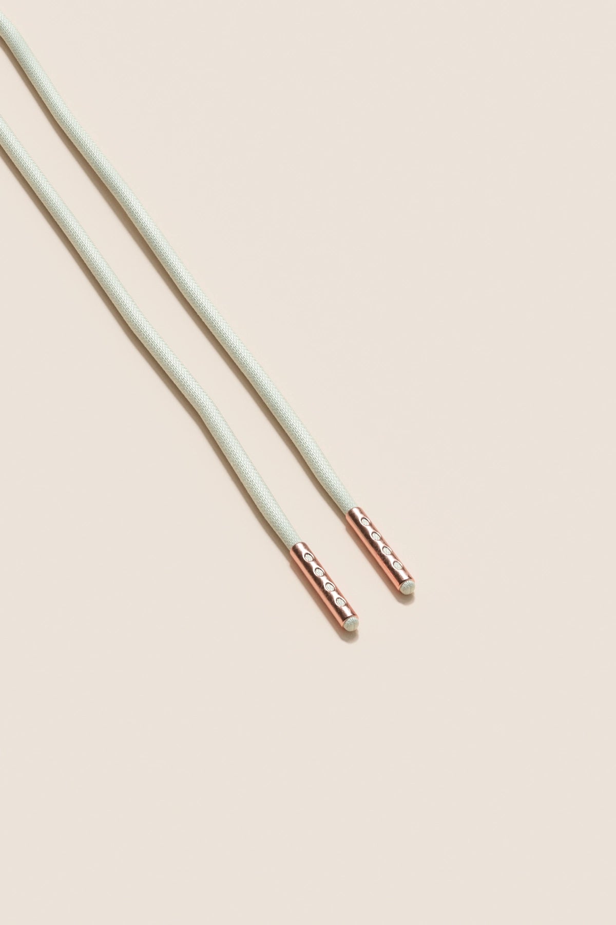 Senkels Off White 2.5mm Round Waxed Shoelaces with Rose Gold Aglets
